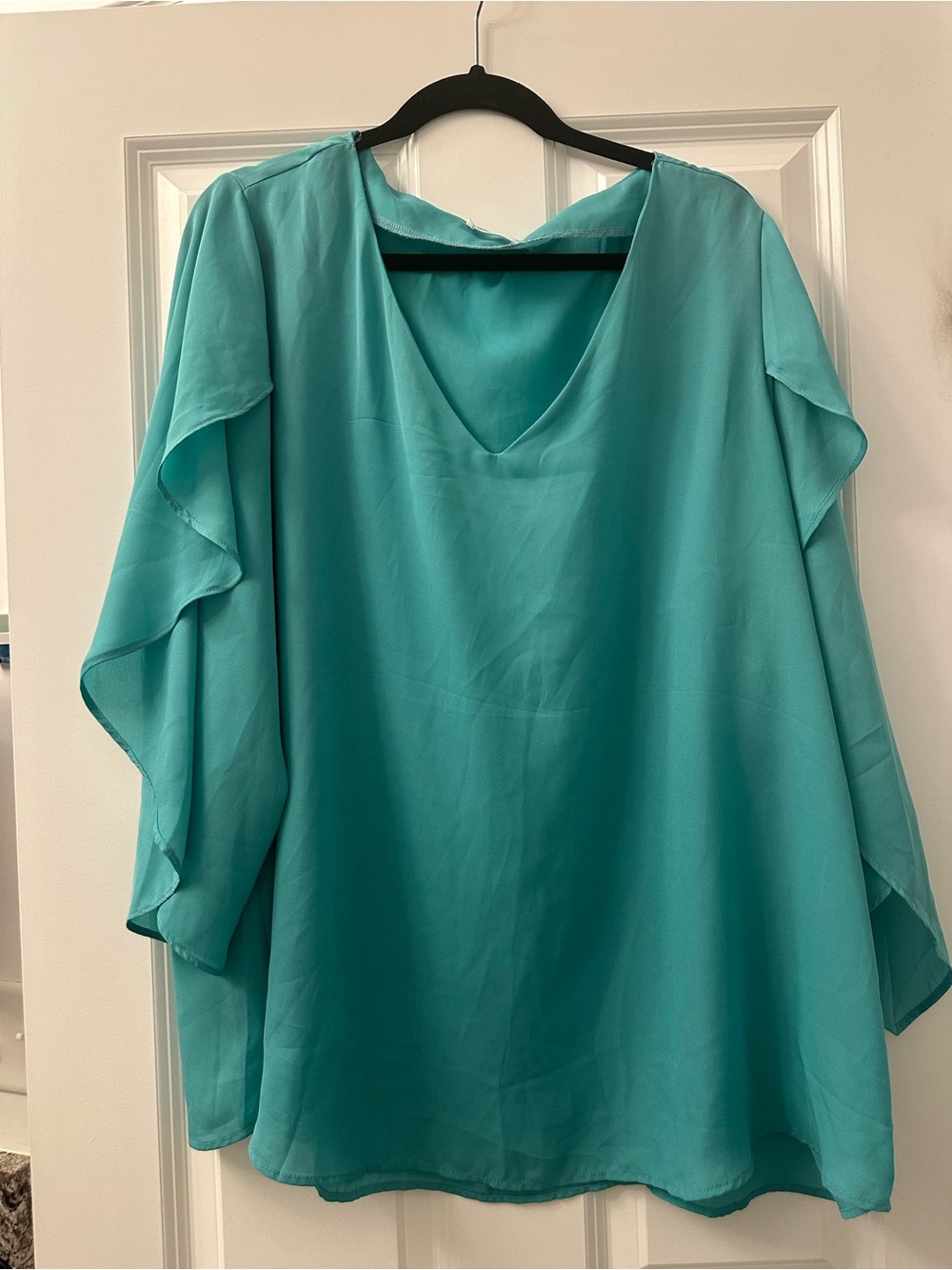 Beautiful flowy teal blouse